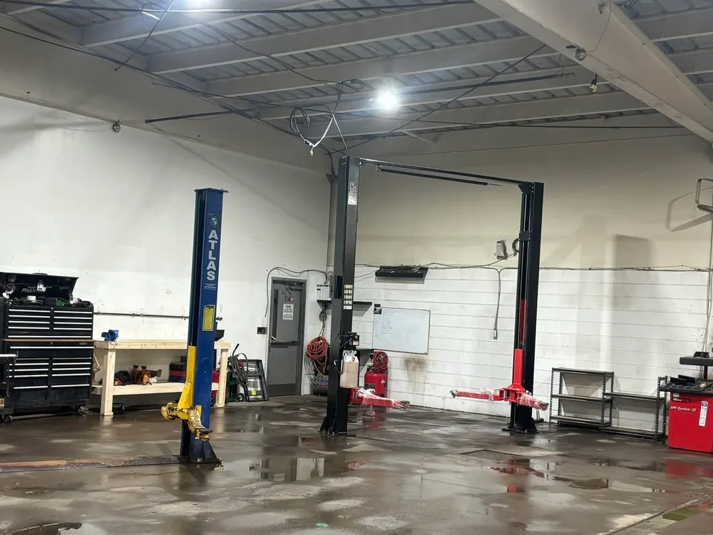 Service bay with two-post hoists at AutoNorth Auto Repair in North Bay